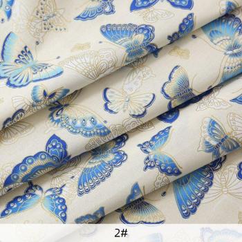 Tela de algodón con estampado de mariposas en bronce y azul para proyectos artesanales, TJ0451