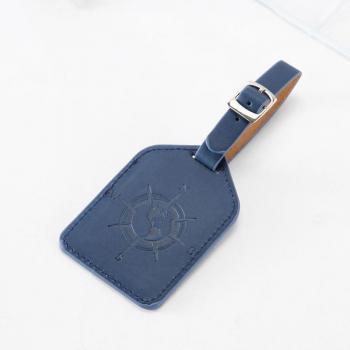 Étiquette de voyage en cuir avec motif boussole