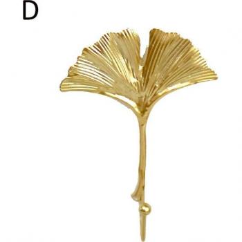 Colgador de pared para hogar con hojas de metal dorado y verde